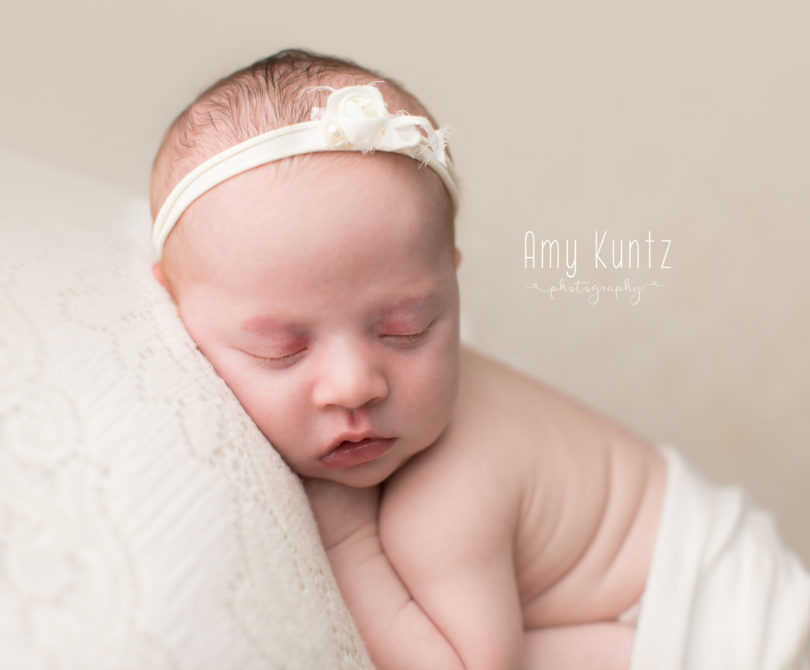 picture of newborn girl in bum up pose with kansas city newborn photography