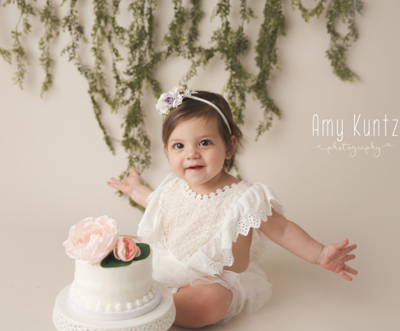 one year old floral simple cake smash photography in Kansas City